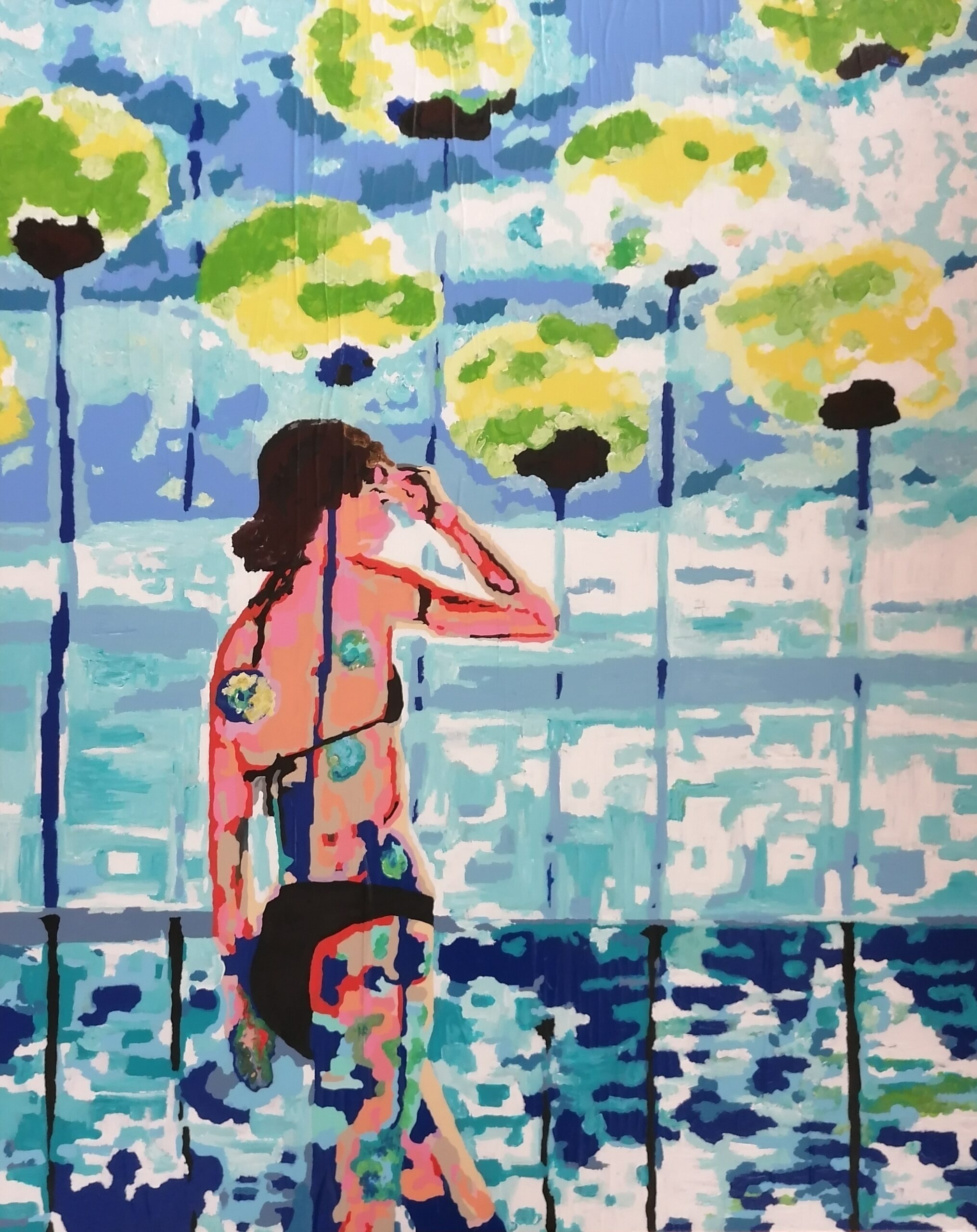 jeune femme en maillot de bain regardant la mer